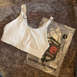 Brand new Born Primitive zip front sports bra